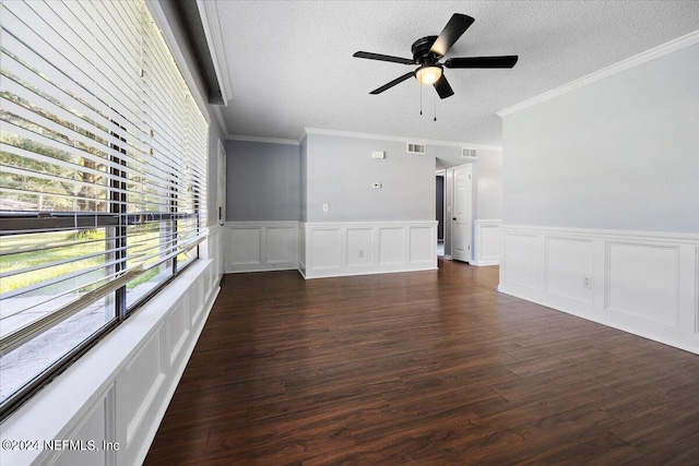 unfurnished living room featuring ornamental molding, ceiling fan, a textured ceiling, and dark hardwood / wood-style flooring