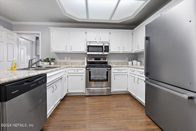 kitchen with white cabinetry, stainless steel appliances, sink, and dark hardwood / wood-style floors