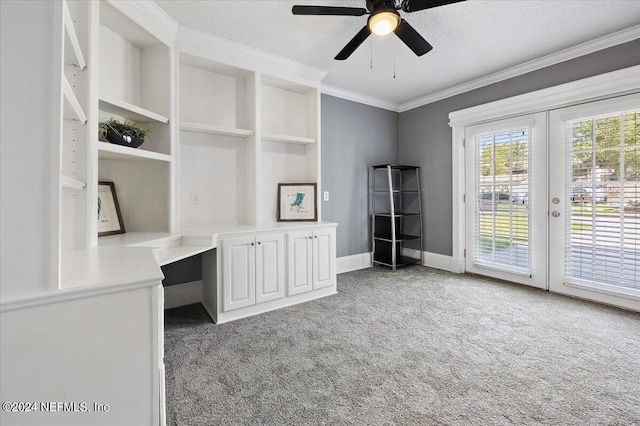 unfurnished office with crown molding, a textured ceiling, and light colored carpet