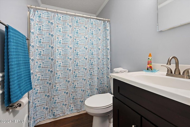 bathroom with a textured ceiling, wood-type flooring, toilet, vanity, and crown molding