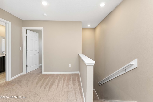 7716 Merchants Way, Jacksonville, FL 32222 - corridor with an upstairs landing, recessed lighting, baseboards, and light carpet