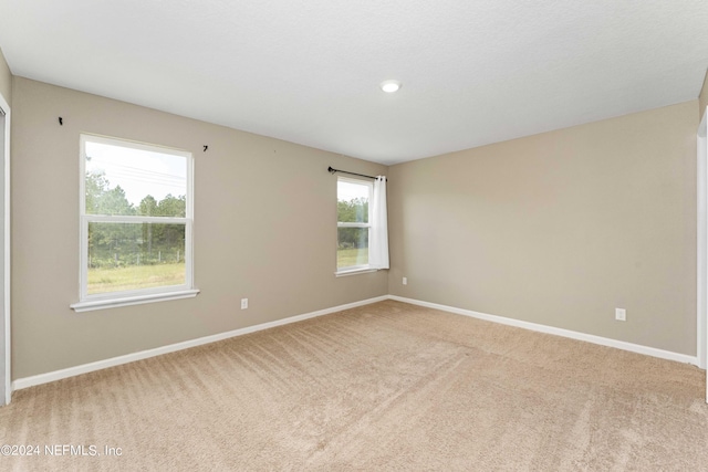 7716 Merchants Way, Jacksonville, FL 32222 - empty room featuring light carpet and baseboards