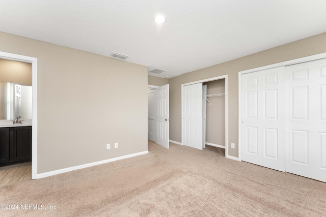 7716 Merchants Way, Jacksonville, FL 32222 - unfurnished bedroom featuring baseboards, visible vents, light colored carpet, and multiple closets