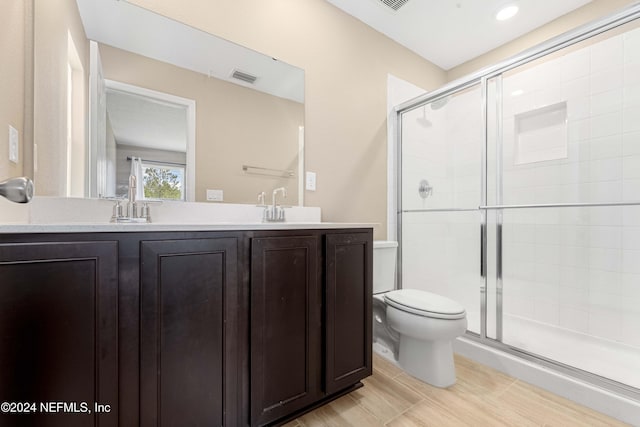 7716 Merchants Way, Jacksonville, FL 32222 - bathroom with a sink, a stall shower, toilet, and visible vents