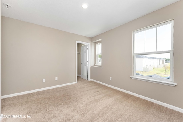 7716 Merchants Way, Jacksonville, FL 32222 - unfurnished room featuring baseboards and light carpet