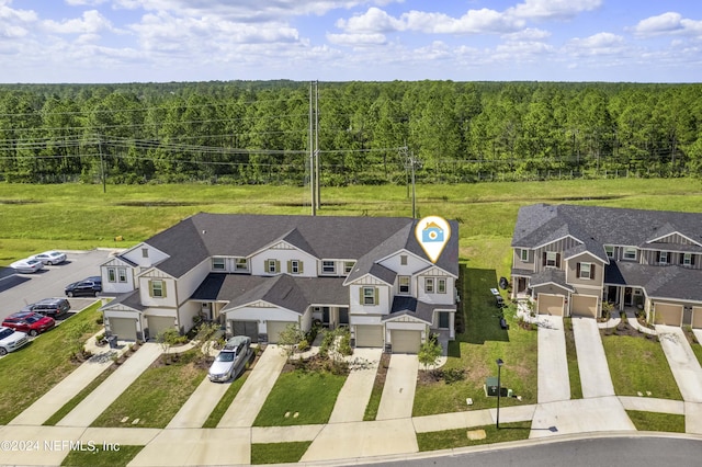 7716 Merchants Way, Jacksonville, FL 32222 - aerial view featuring a wooded view