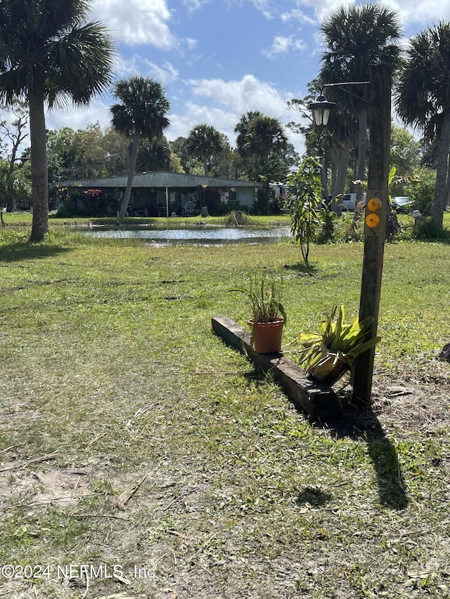 view of home's community with a water view