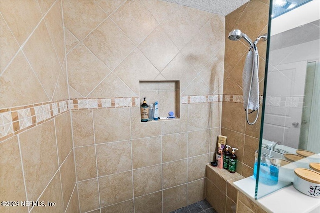 bathroom featuring tiled shower