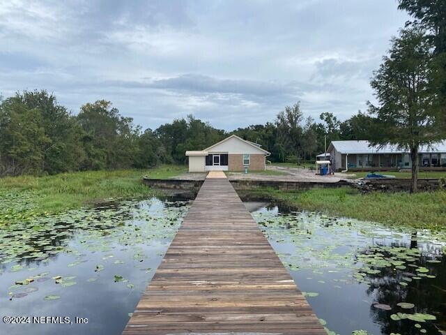 dock area with a water view