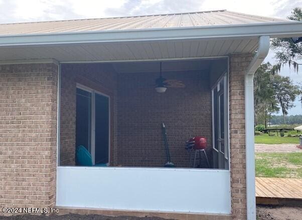 view of patio / terrace featuring ceiling fan