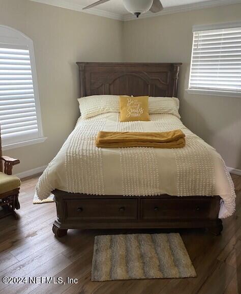 6664 SW 160th St, Starke, FL 32091 - bedroom featuring crown molding, wood finished floors, baseboards, and ceiling fan