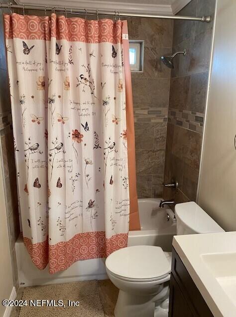 6664 SW 160th St, Starke, FL 32091 - bathroom with shower / bathtub combination with curtain, toilet, and vanity