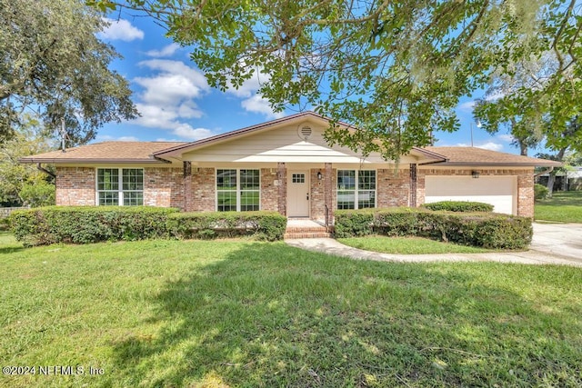 ranch-style home with a garage and a front yard