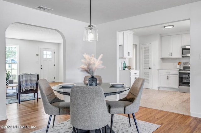 dining room with light wood-type flooring