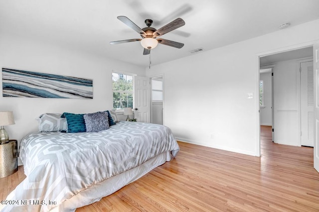 bedroom with ceiling fan and light hardwood / wood-style floors