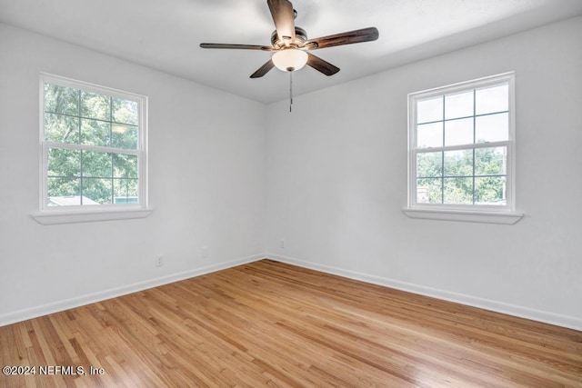 empty room with light hardwood / wood-style floors and ceiling fan