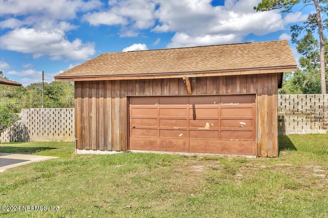 garage with a yard