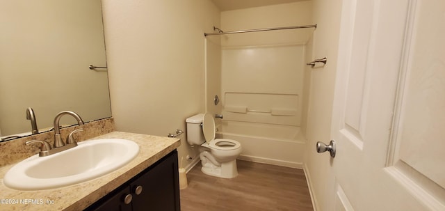 full bathroom with shower / tub combination, hardwood / wood-style flooring, vanity, and toilet