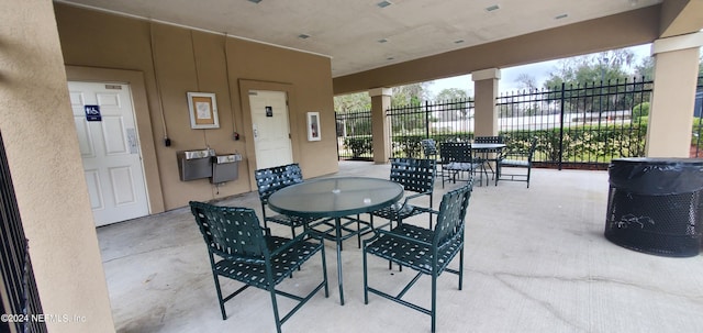 dining area featuring concrete flooring