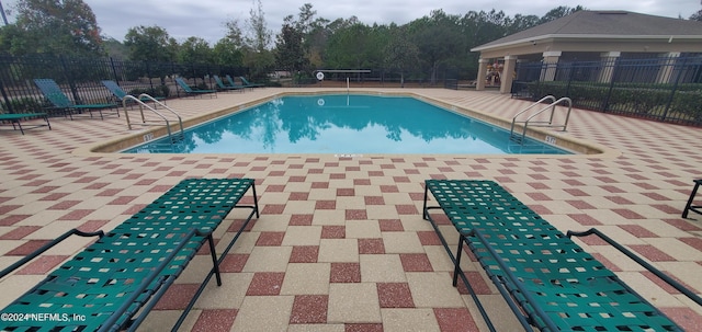 view of pool featuring a patio area