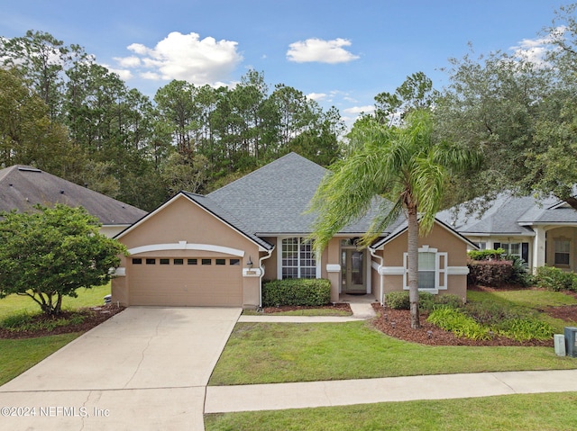 view of front facade featuring a front yard and a garage