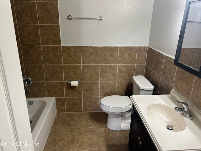 full bathroom featuring vanity, tile walls, tile patterned flooring, toilet, and shower with separate bathtub