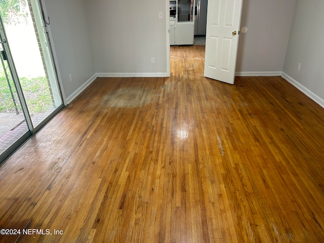 spare room featuring dark hardwood / wood-style flooring