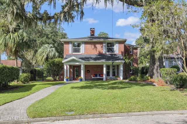 view of front facade featuring a porch and a front lawn