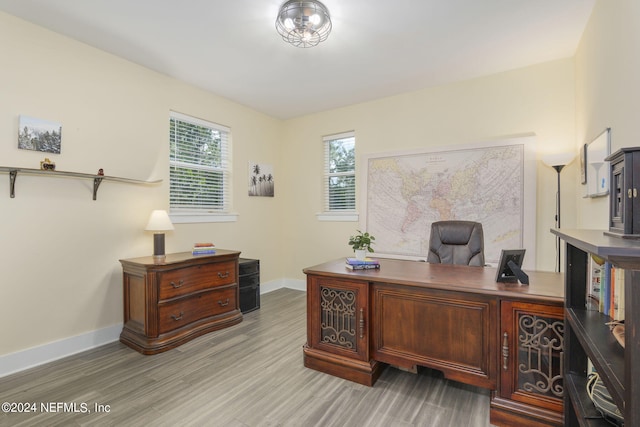 office with light hardwood / wood-style flooring