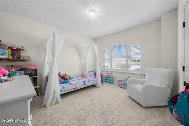 carpeted bedroom with a textured ceiling