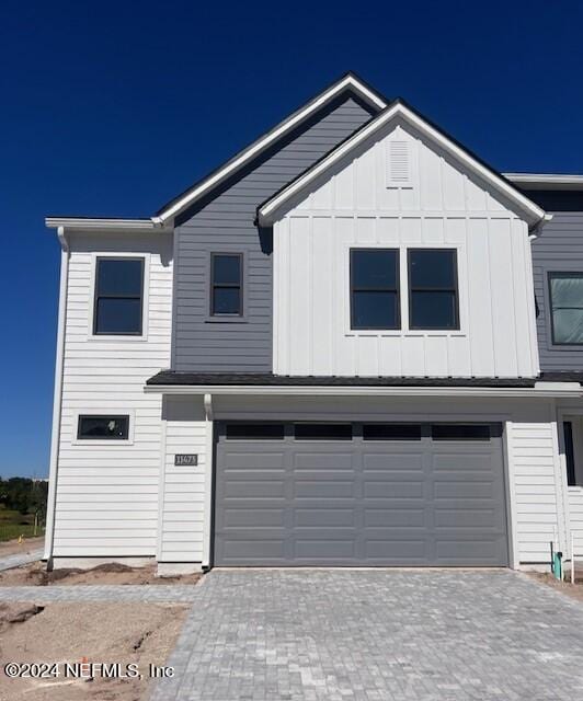 view of front of property with a garage