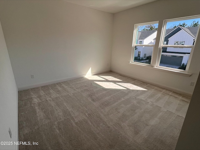 empty room featuring light colored carpet