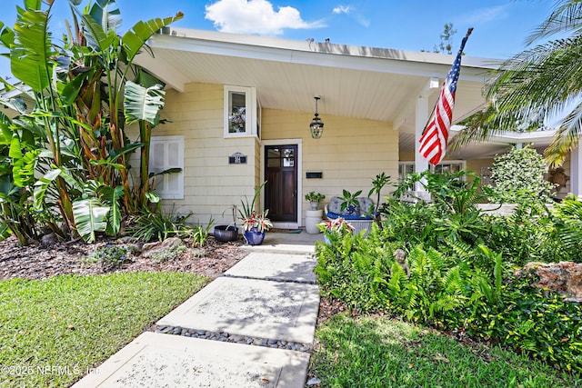 doorway to property with covered porch