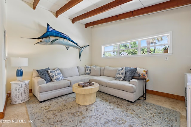 living room with baseboards and beamed ceiling