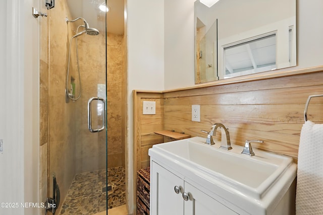 bathroom with vanity and a shower stall
