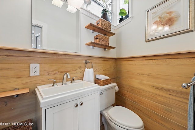 bathroom with toilet and vanity