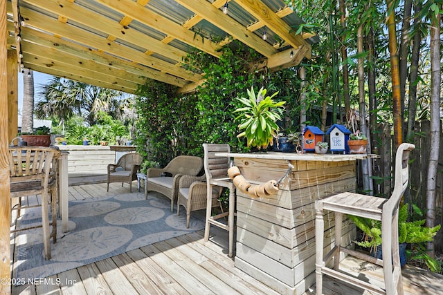wooden deck featuring outdoor dry bar