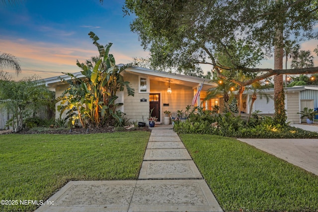view of front of house with a front lawn