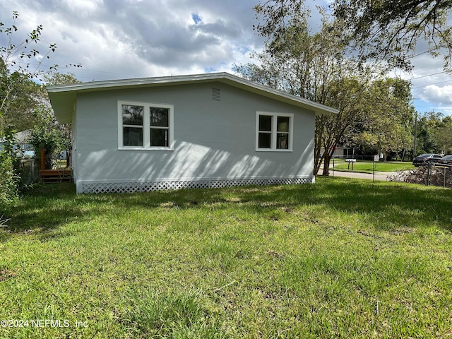 view of property exterior featuring a yard