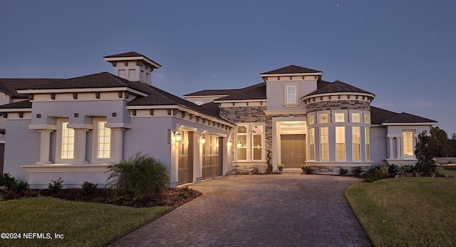 view of front of home with a lawn