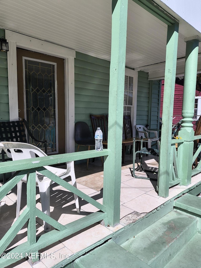 view of patio featuring a porch