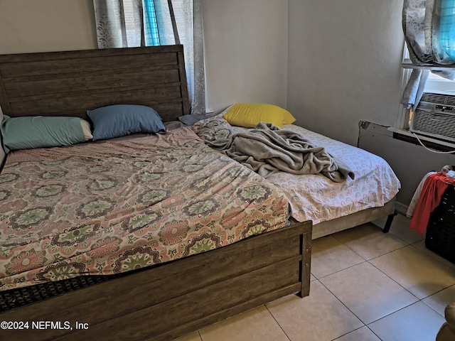 bedroom featuring light tile patterned floors