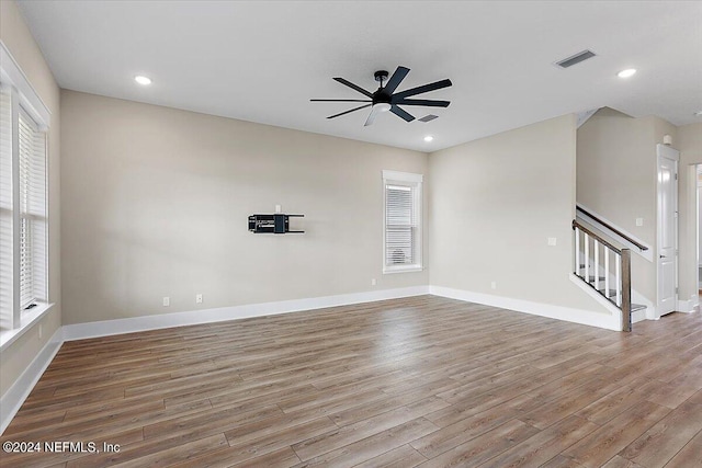 unfurnished living room with ceiling fan and light wood-type flooring