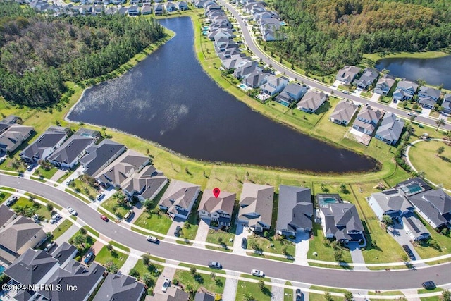 drone / aerial view with a water view