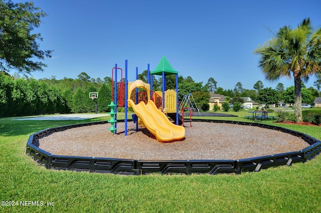 view of playground with a lawn