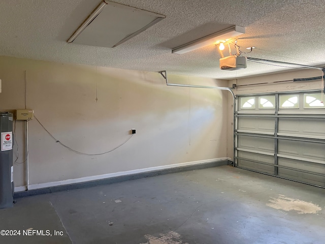 garage with a garage door opener and electric water heater