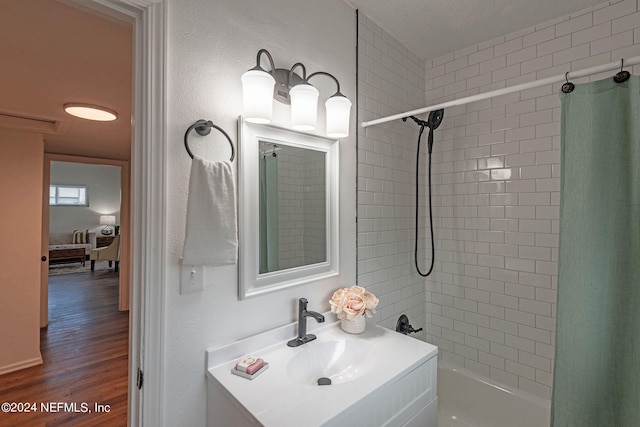 bathroom with vanity, shower / bath combination with curtain, and hardwood / wood-style flooring