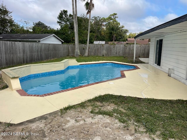 view of swimming pool with a patio area