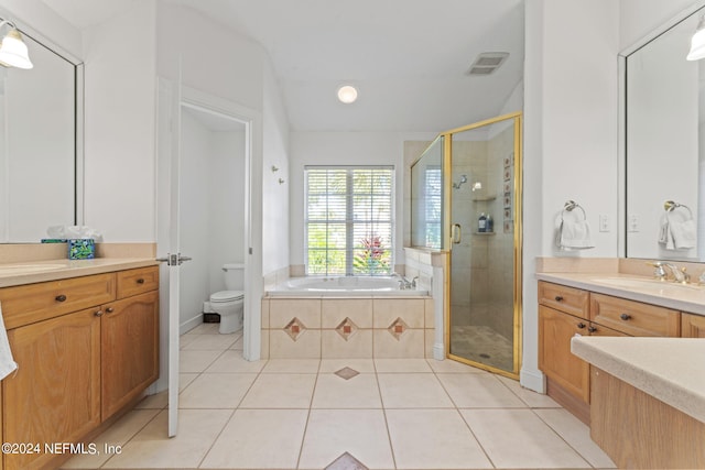 bathroom featuring toilet, a stall shower, tile patterned flooring, and visible vents