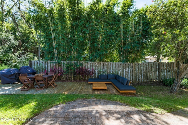 view of yard with a deck and fence